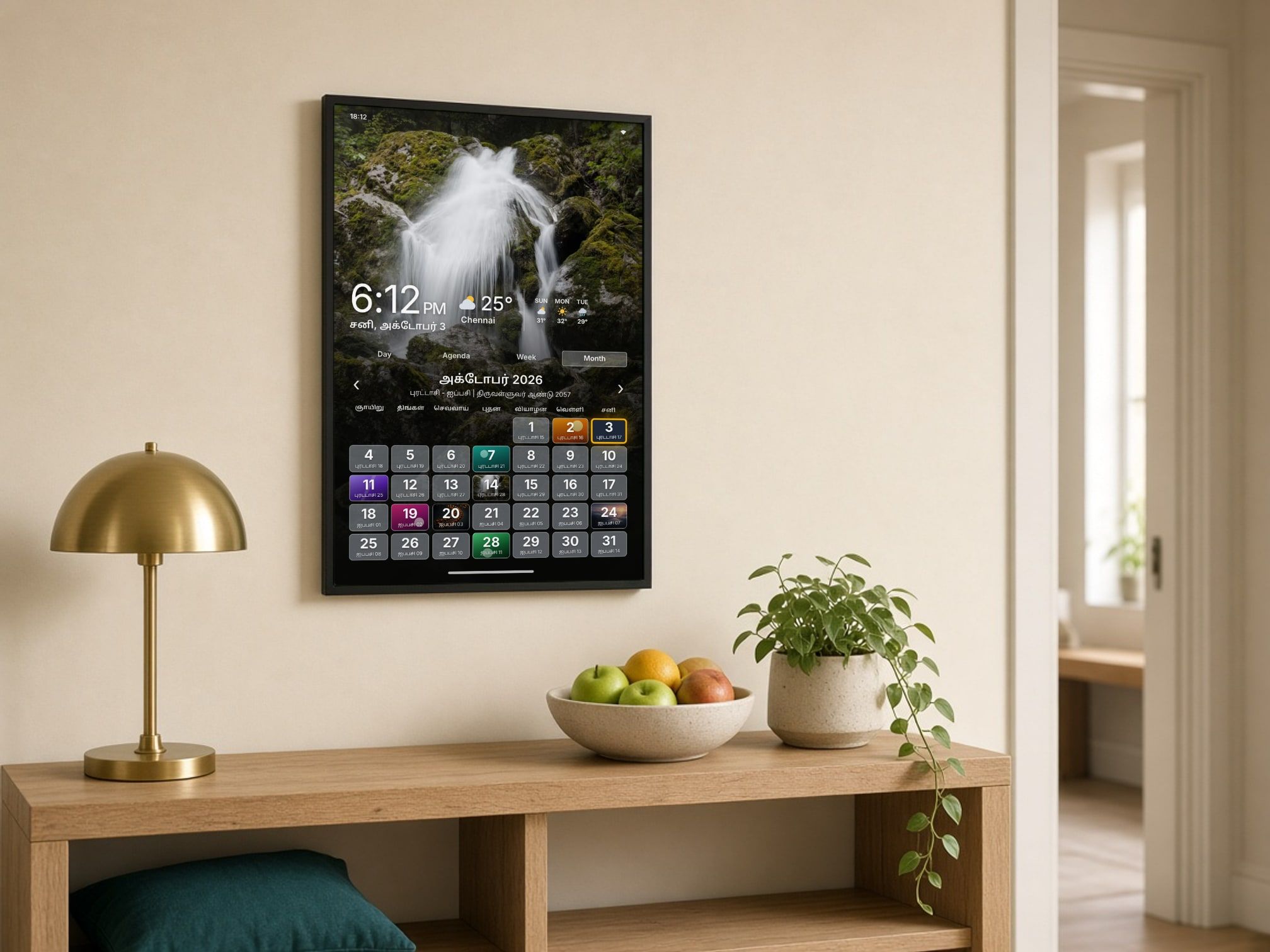 A slim ThiraiOne Wall display in a hallway, showing the month calendar and weather.